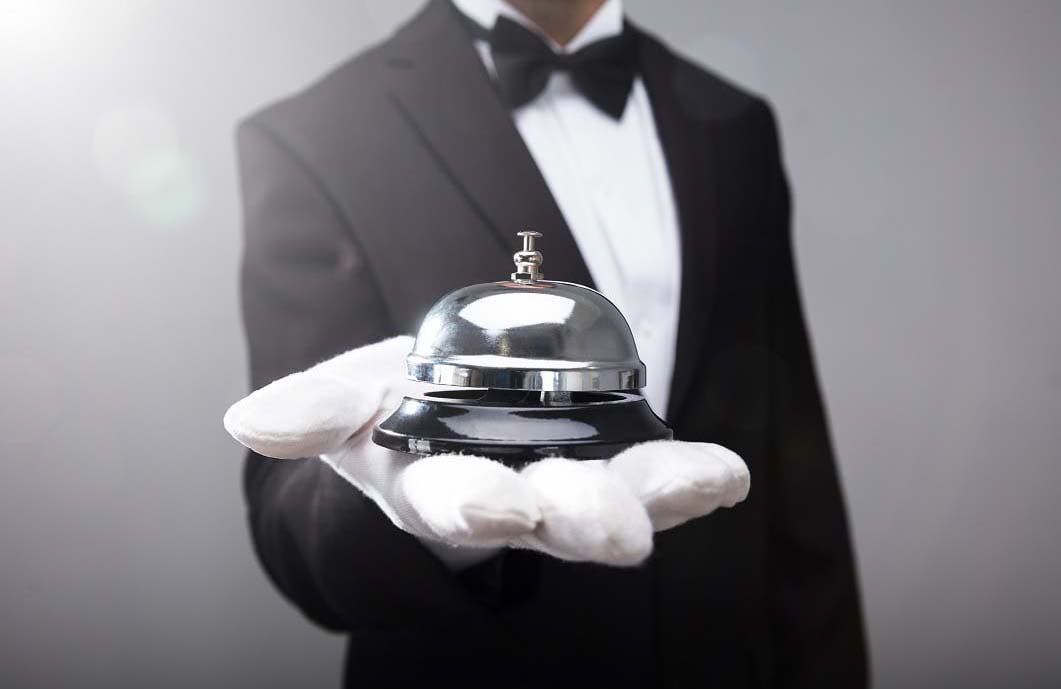 Waiter Holding Service Bell